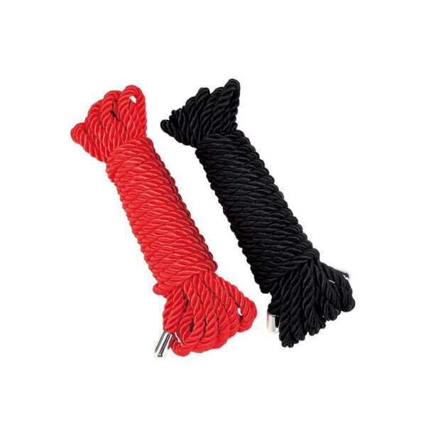 Two coiled ropes, one red and one black, placed side by side on a white background.