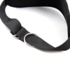 A person wearing a black bondage harness with attached wrist restraints, shown from the back.
